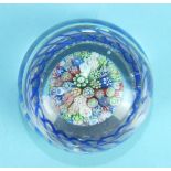 A 19th century French millefiori upright paperweight with a blue and white twisted band at base,