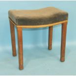 An Elizabeth II Coronation stool, the blue velvet seat, faded, on chamfered limed oak legs, the