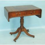 A Georgian-style mahogany drop-leaf side table, the top with reeded edge above two drawers on turned