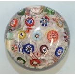 A Baccarat spaced millefiore paperweight dated B1847 with assorted canes including a dog, a goat,