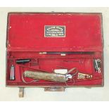 A brass bound leather double shotgun case, labelled for William Evans, 83cm wide, 34cm deep, 10cm