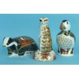 A collection of three Crown Derby animal paperweights, 'Moonlight Badger' (gold), 'Meercat' (