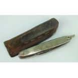 A 14ct gold sided penknife with two blades and a pair of scissors, length 61mm (closed).