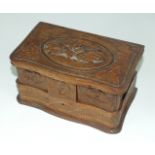 A Continental carved wood jewellery box with hinged lid and jewellery compartments, 20.5cm wide,