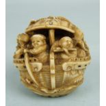 A fine Japanese ivory okimono of a group of men aboard a dragon boat, on stormy waves with