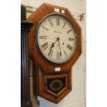 An Ansonia stained wood octagonal-shaped drop-dial wall clock, 63cm high, (a/f).