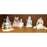 Four Royal Doulton figurines, 'The Bedtime Story' HN2059, 'Treasure Island' HN2243, 'Alice' HN2158