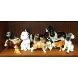 Ten various ceramic and composite dog ornaments, (10).