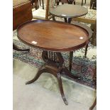 A reproduction oval tray-top occasional table on harp support and quadruped base, 62 x 45cm and a