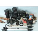 A Vivitar V335 camera with SMC Pentax-M 1:1.7 50mm lens, three other lenses and other accessories,