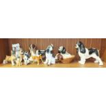 Ten various ceramic and composite dog ornaments, (10).