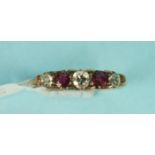 WITHDRAWN A ruby and diamond half hoop ring, claw set three brilliant cut diamonds.