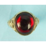 A 9ct gold ring set a foiled red paste cabochon, N 1/2, 3.3g.