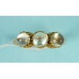 A Victorian moonstone ring claw set three round moonstones in 18ct gold mount, size O 1/2, 3.6g.