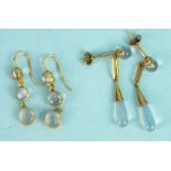 A pair of earrings of three linked collet set moonstones, and another pair of moonstone drop