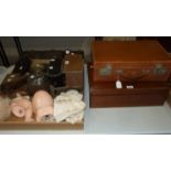 A Japanese polished-metal hand mirror, a Kodak folding camera, a ceramic-headed doll and