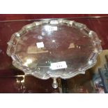 A Mappin & Webb silver salver on three hooved feet, Sheffield 1924, 27.5cm diameter, ___19oz, (