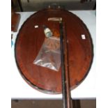 An inlaid mahogany oval tray, (in need of restoration) and two walking canes, (3).