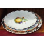 An early-20th century Meissen dish decorated with fruit, gilding lacking, 27.5cm, an Imari dish (a/