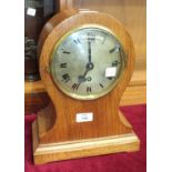 An early-20th century balloon-cased mantle clock, the movement stamped 'Tame Side, Made in