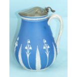 A 19th century blue and white jasperware metal-lidded jug decorated with lily of the valley and