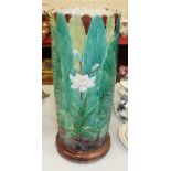 An English majolica stick stand decorated with ferns and flowers, 55cm high, 22cm diameter, (a/f).