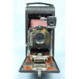 A Kodak folding pocket camera No. 3A by Eastman Kodak Co, with case.