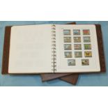 A collection of unmounted mint modern British Empire sets in two albums.