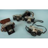 A large assortment of SLR cameras and equipment including : Fed 4, Solida II, Canon QL, Yashica