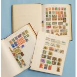 An all-world collection of stamps in two albums and loose.