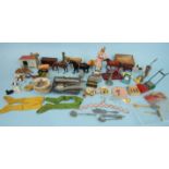 A wooden box containing an assortment of lead animals, doll's house telephone, hoover, lawn mower,