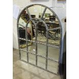 A modern metal-framed arched wall mirror, 123cm high, 92cm wide.