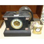 A black-slate-cased striking mantel clock, the movement stamped 'Marti', 22cm high, an oak-cased