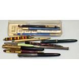 A Parker Slimfold fountain pen, a silver propelling pencil, three other fountain pens, etc.