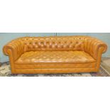 A leather-covered horse-hair-upholstered button-back-and-seat Chesterfield settee, 210cm wide.