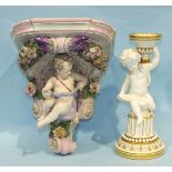 A Minton's late-19th/early-20th century candle holder/sconce supported by a cherub seated on a