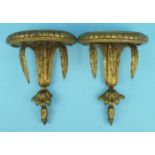 A pair of 19th century gilt gesso half-round wall brackets, 19cm wide, 24cm high, (2).