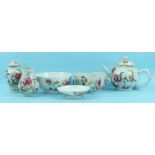 An 18th century Chinese famille rose part tea service decorated with flowering shrubs, comprising