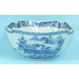 An 18th century Chinese porcelain shaped-rim square bowl painted with pagodas in watery