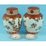 A pair of 19th century Japanese pottery vases, covers and inner liners in Kutani style, decorated