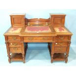 A late-Victorian walnut estate/office desk, the top with two small cupboards enclosing pigeon