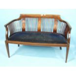 An Edwardian mahogany eight-piece salon suite, each piece with open slatted back and drop-in