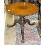 A Georgian mahogany circular occasional table on turned column and leaf-carved tripod, with claw and