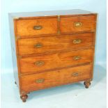 A teak military chest of two short and three long drawers, in two sections, with brass host handles,
