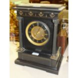 A black marble mantel clock of architectural form, the two-piece gilt metal dial signed 'Page,