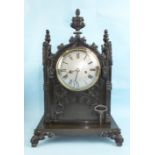 A Victorian Gothic Revival patinated bronze bracket clock, the architectural-form case on wide