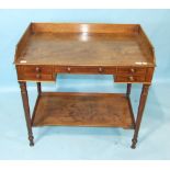 A 19th century mahogany wash stand, the galleried rectangular top above four small drawers, on