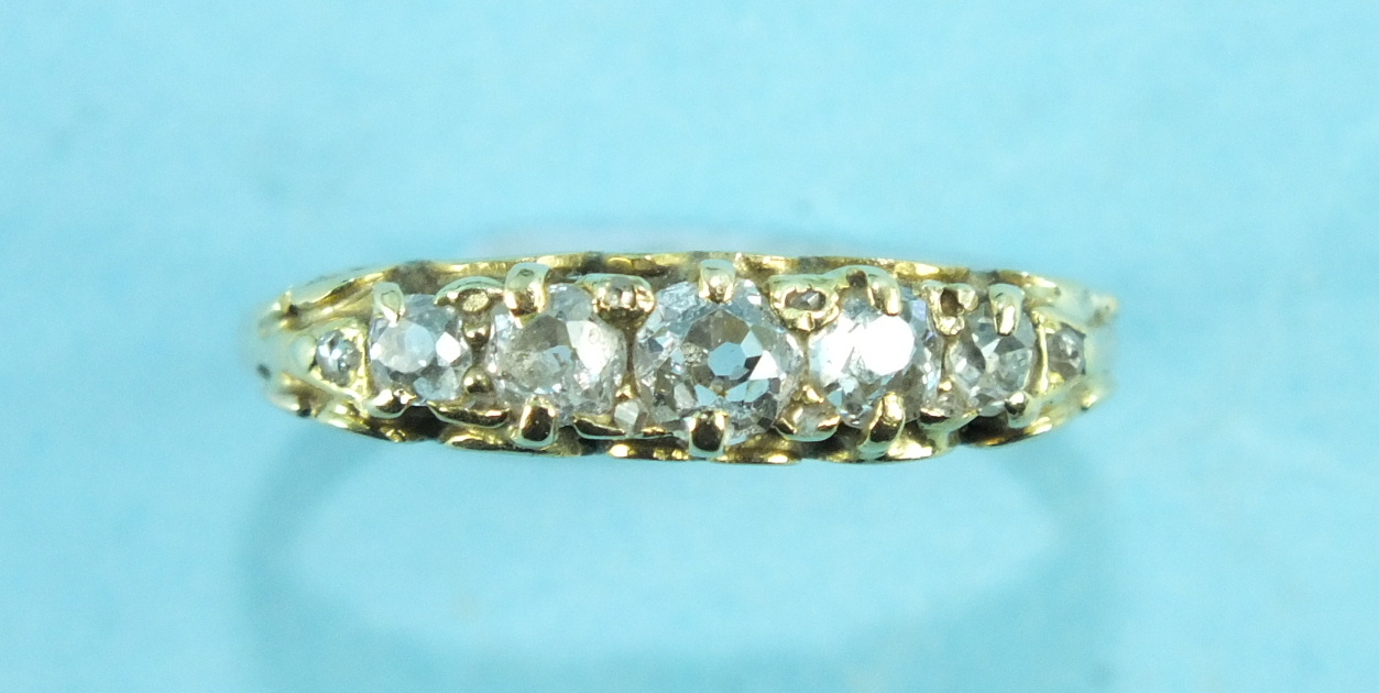 A Victorian five-stone diamond ring, the graduated old-cut diamonds claw set with diamond points