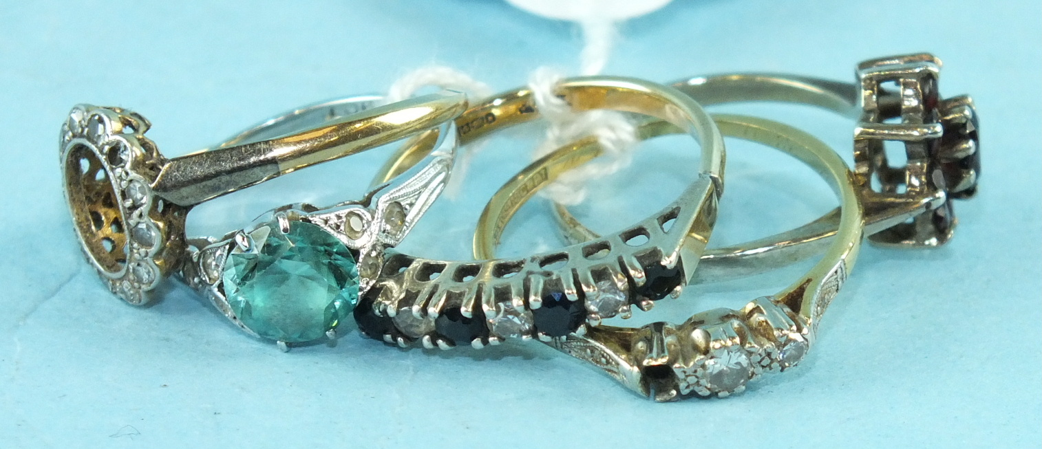 Two 18ct gold and platinum rings set diamonds, both with vacant settings, a zircon and synthetic