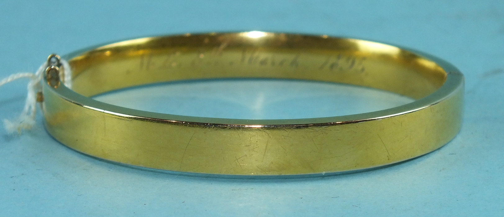 A Victorian unmarked yellow gold hinged bangle, 12.9g.